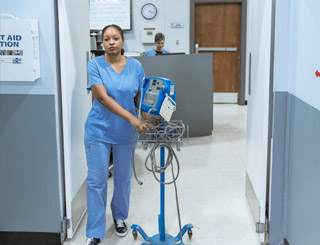 NHS nurse in hospital corridor